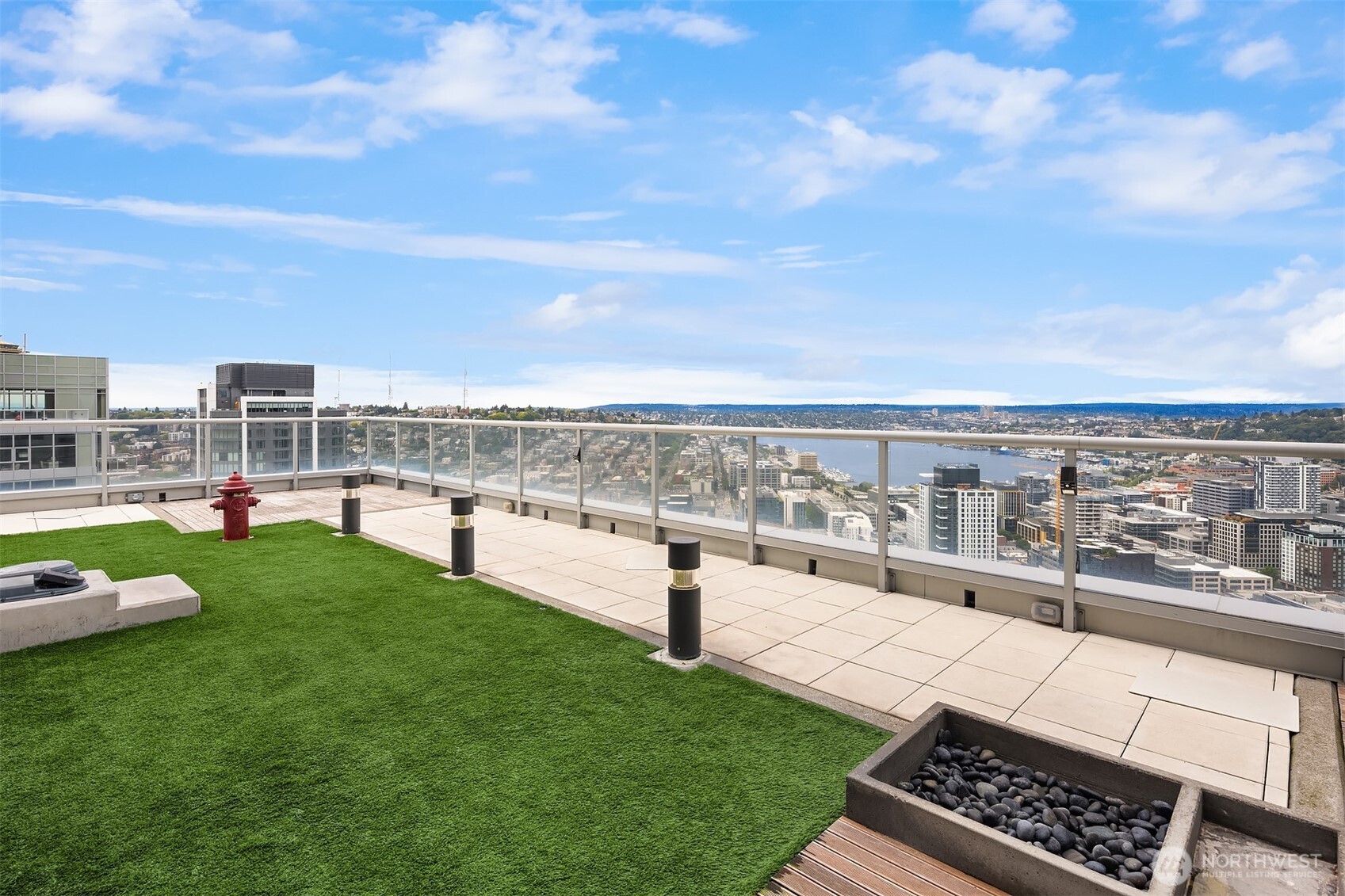 588 Bell Street, Unit 214S Seattle, WA 98121 - Photo 33 of 40 a view of a terrace with lawn chairs