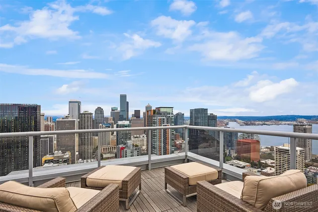 a room with pool table and large windows