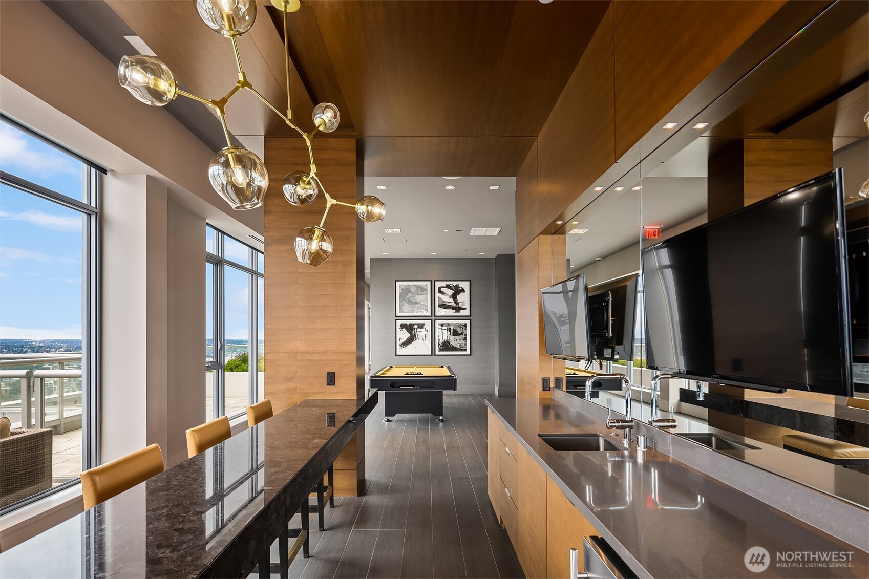588 Bell Street, Unit 214S Seattle, WA 98121 - Photo 35 of 40 a view of a dining room with furniture a chandelier and large windows