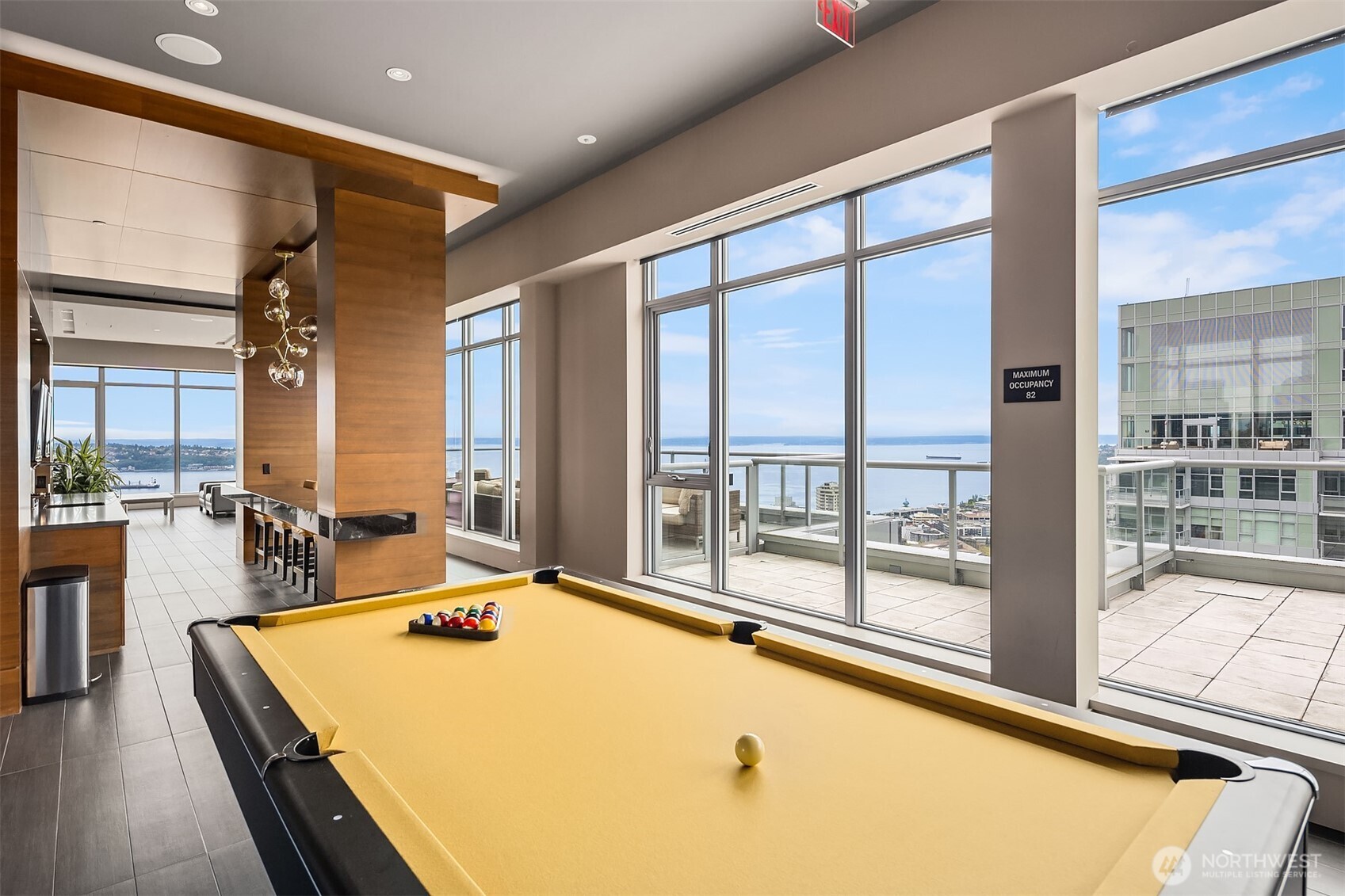 588 Bell Street, Unit 214S Seattle, WA 98121 - Photo 36 of 40 a room with pool table and large windows