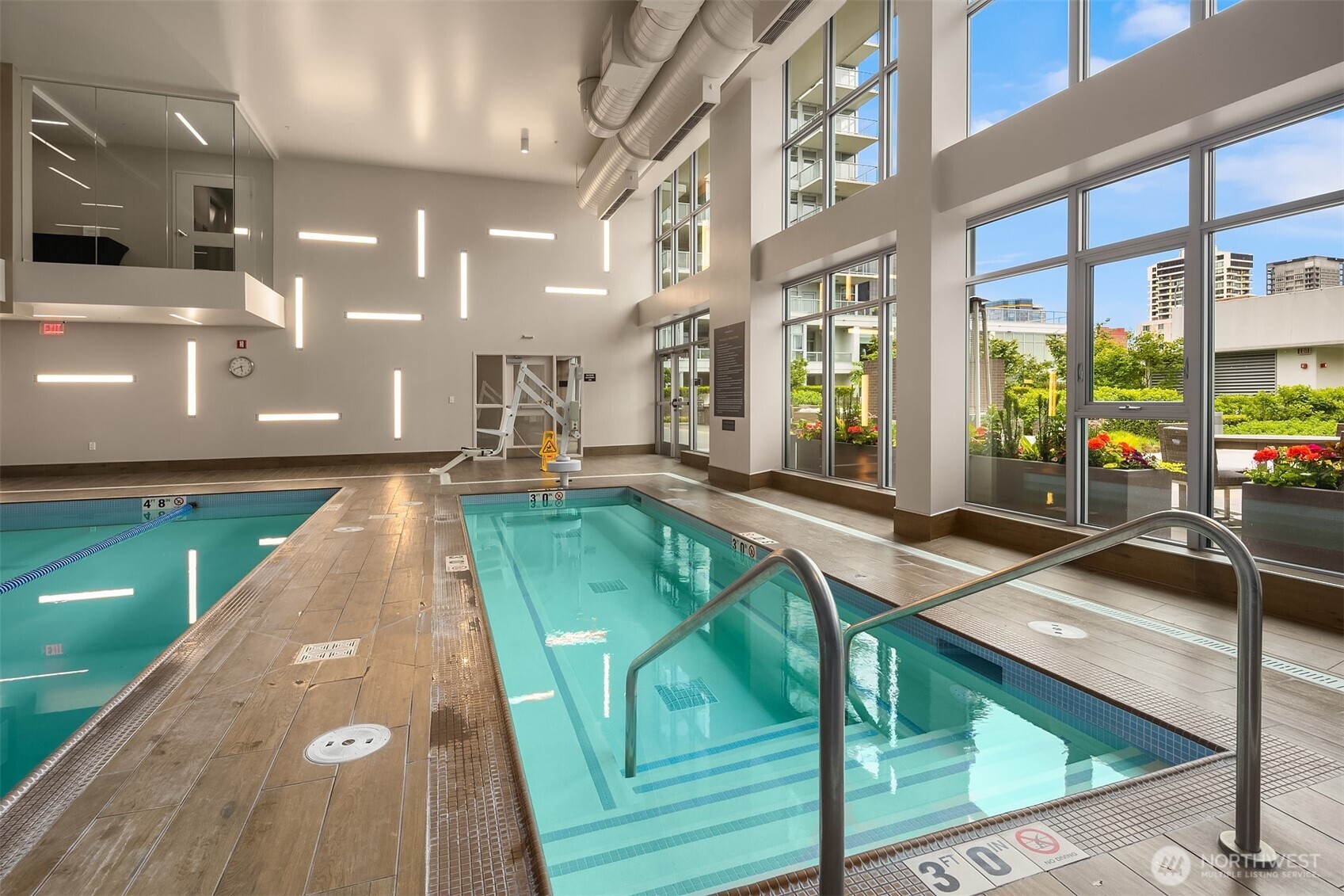 588 Bell Street, Unit 214S Seattle, WA 98121 - Photo 37 of 40 a swimming pool with outdoor seating and yard