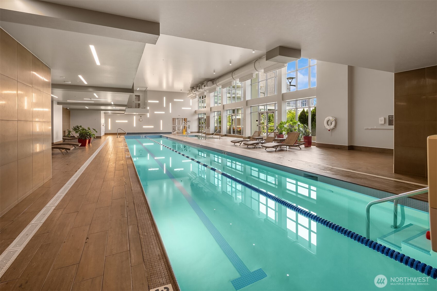 588 Bell Street, Unit 214S Seattle, WA 98121 - Photo 38 of 40 a view of a living room and kitchen with a large window