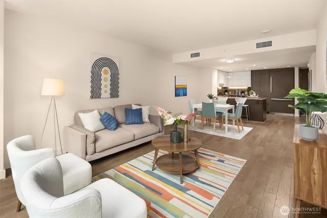 a living room with furniture and a floor to ceiling window