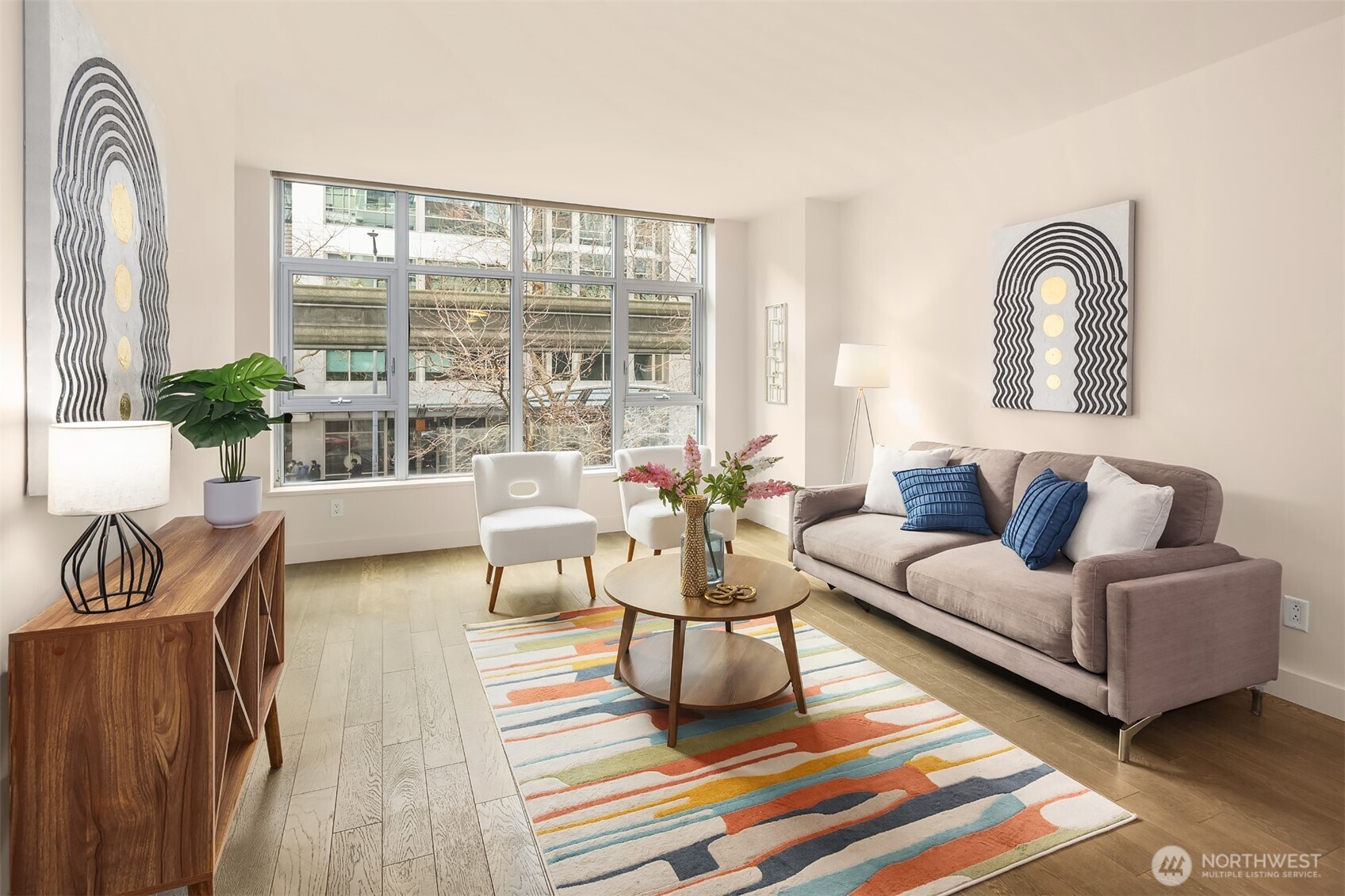 588 Bell Street, Unit 214S Seattle, WA 98121 - Photo 8 of 40 a living room with furniture and a large window