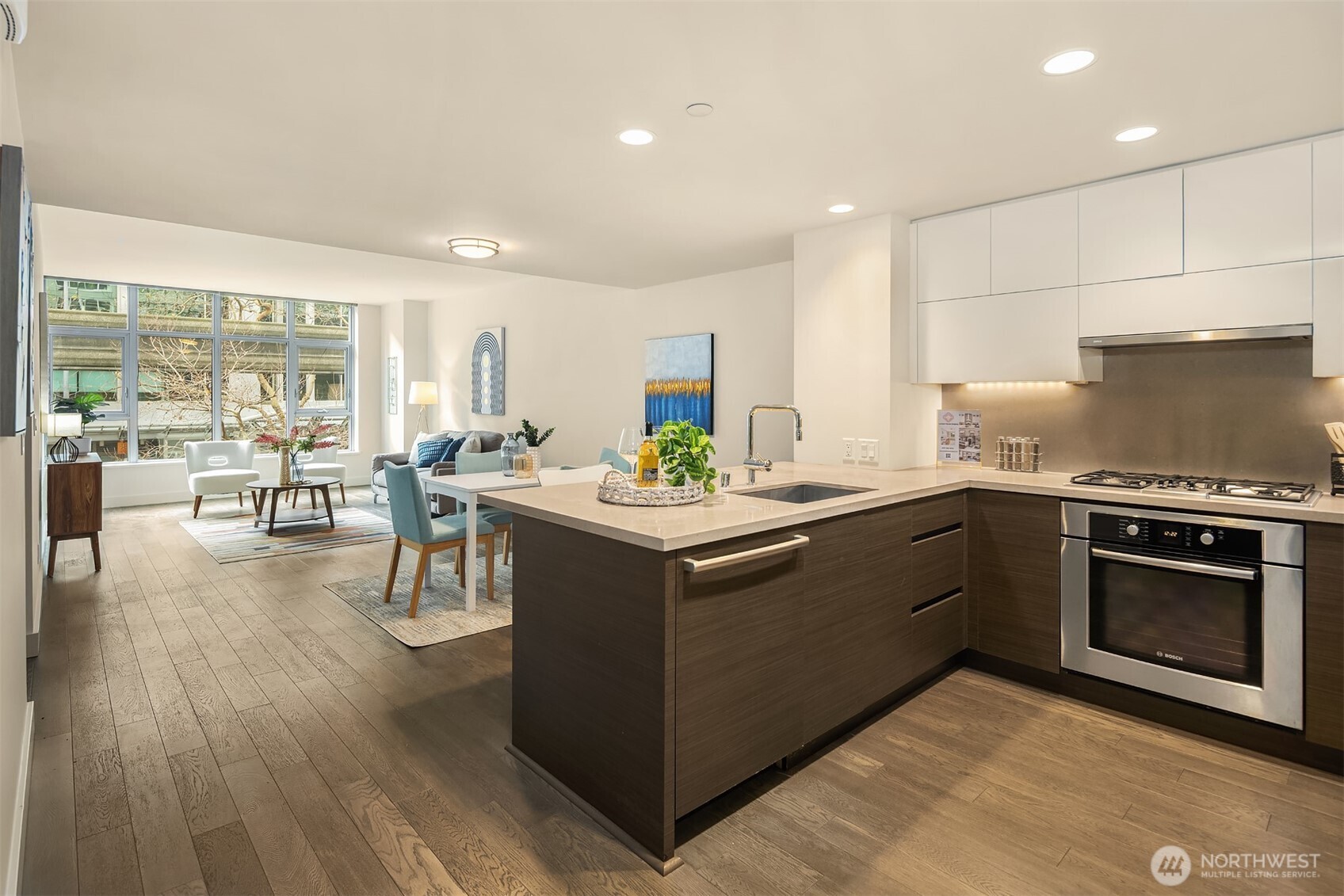 588 Bell Street, Unit 214S Seattle, WA 98121 - Photo 9 of 40 a kitchen with a stove sink and a microwave oven