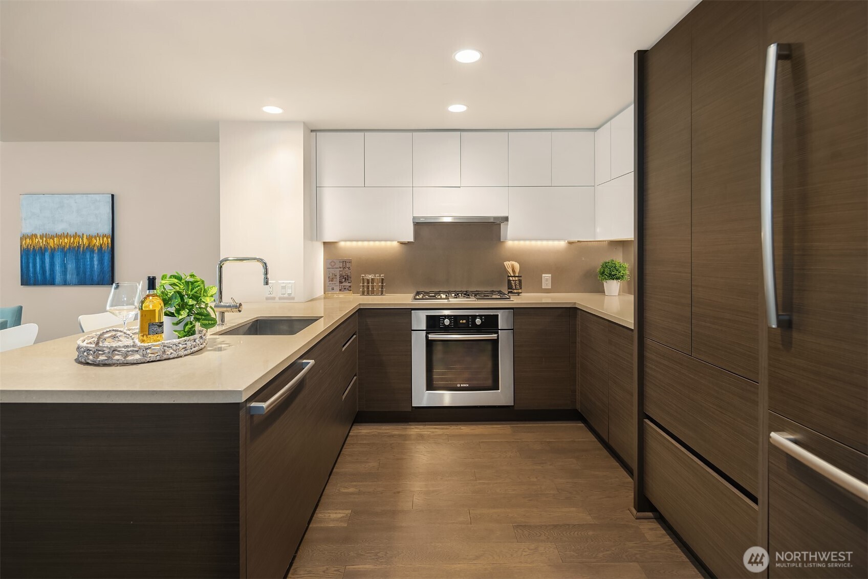 588 Bell Street, Unit 214S Seattle, WA 98121 - Photo 10 of 40 a kitchen with a sink and stainless steel appliances