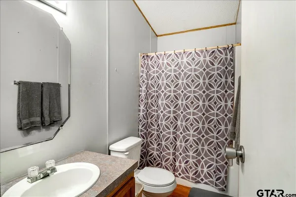 a bathroom with a toilet and a sink
