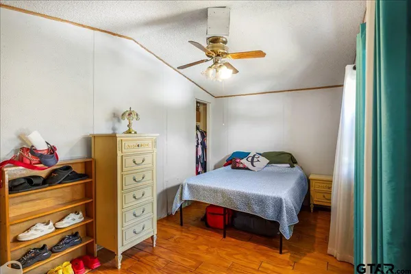 a bedroom with a bed and cabinets
