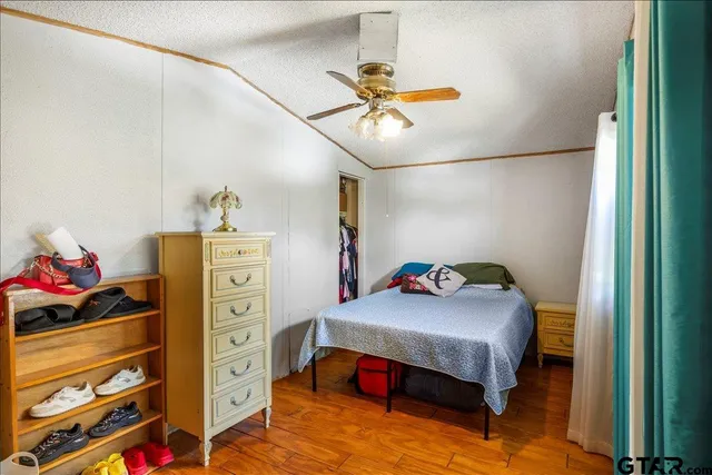 a bedroom with a bed and cabinets