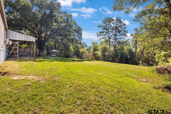 a view of swimming pool with an outdoor space and seating area