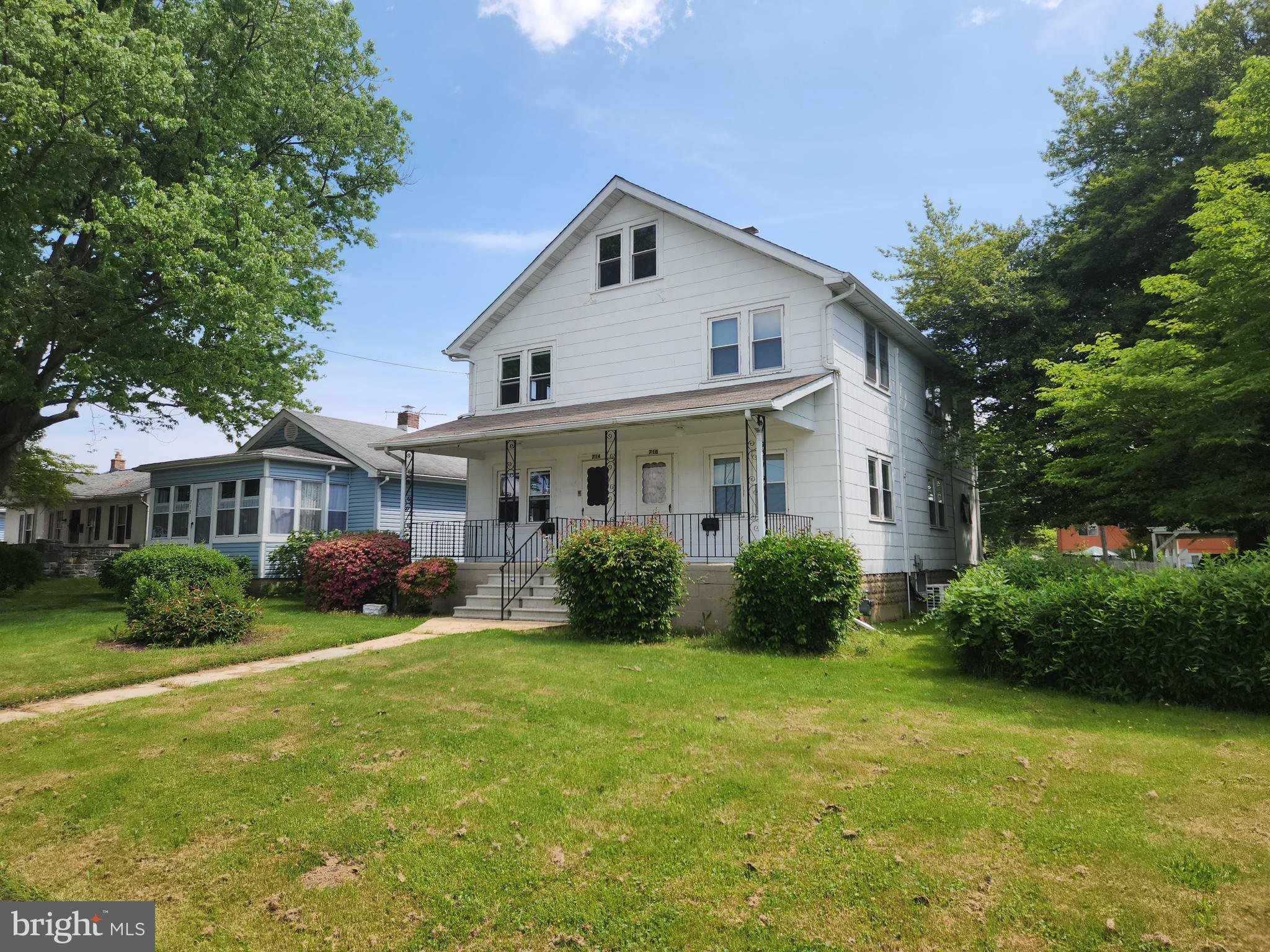 714-716 Revolution Street Havre de Grace, MD 21078 - Photo 1 of 16 a front view of a house with a yard and garage