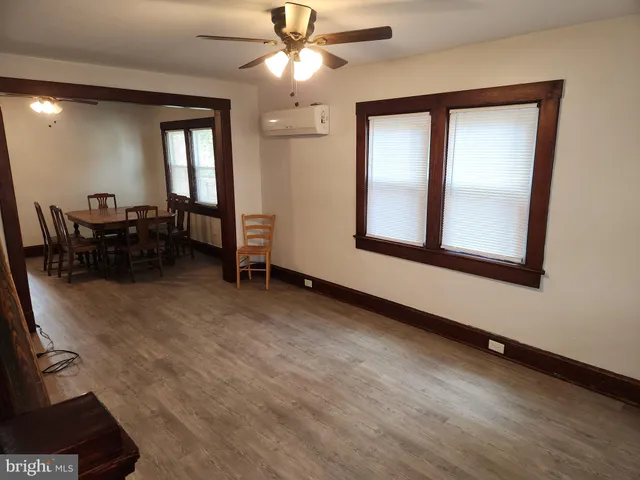 a view of livingroom with furniture and chandelier fan
