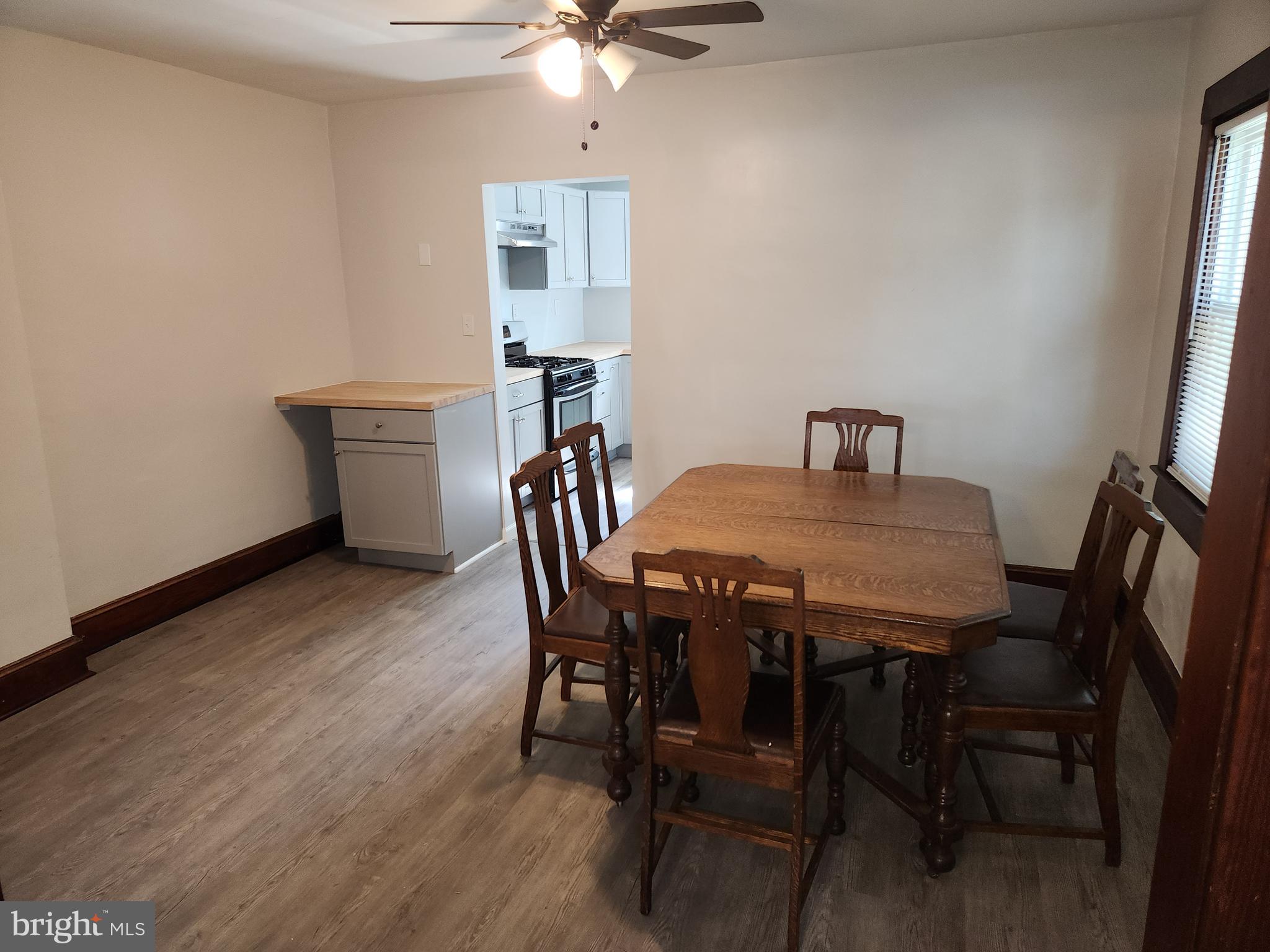 714-716 Revolution Street Havre de Grace, MD 21078 - Photo 3 of 16 a view of a dining room with furniture and wooden floor
