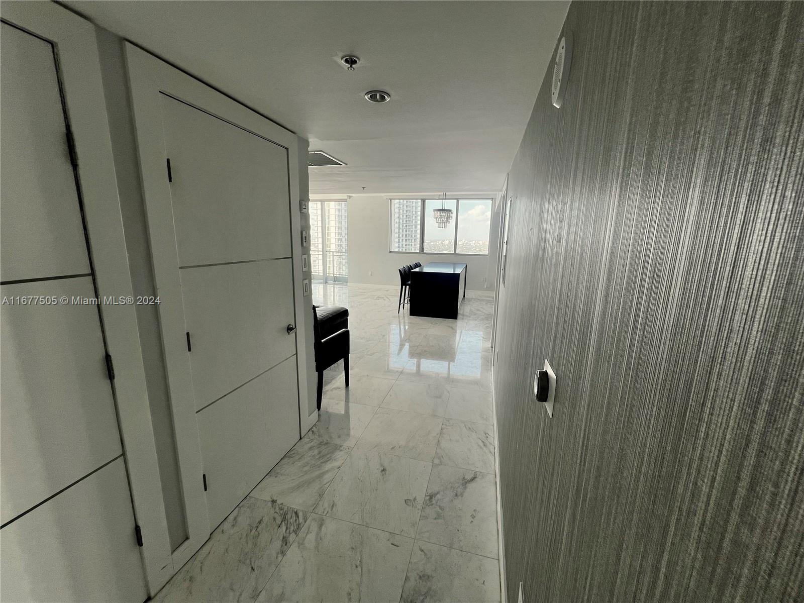 92 Southwest 3rd Street, Unit 3605 Miami, FL 33130 - Photo 15 of 24 a bathroom with a shower and closet