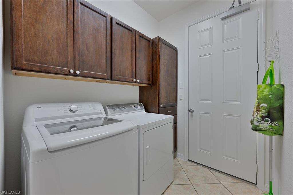8945 Malibu Street, Unit 204 Naples, FL 34113 - Photo 14 of 21 a utility room with dryer and washer