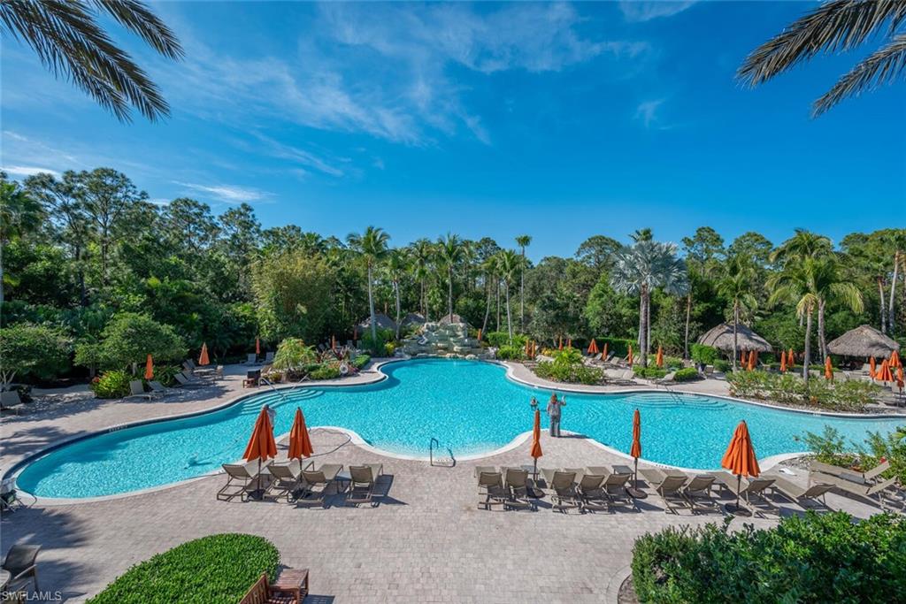 8945 Malibu Street, Unit 204 Naples, FL 34113 - Photo 17 of 21 a view of a garden with plants and a lake view