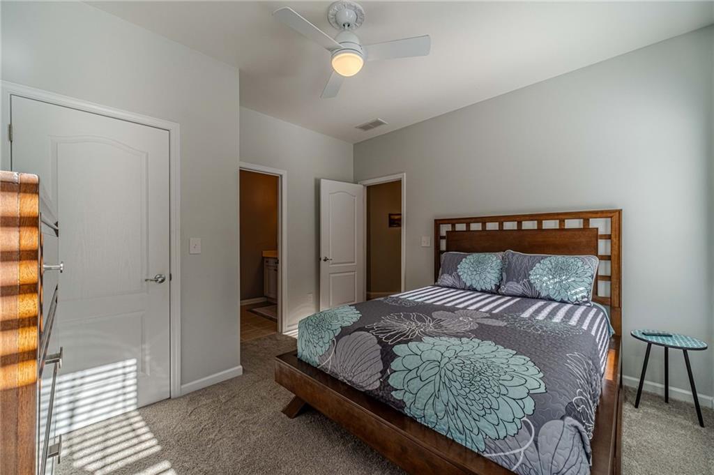 1245 White Columns Drive Monroe, GA 30656 - Photo 19 of 52 a bedroom with a bed and a window