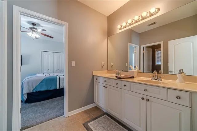 a bed room with a bed and a chandelier