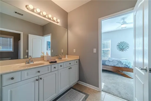 a spacious bathroom with a tub shower and sink