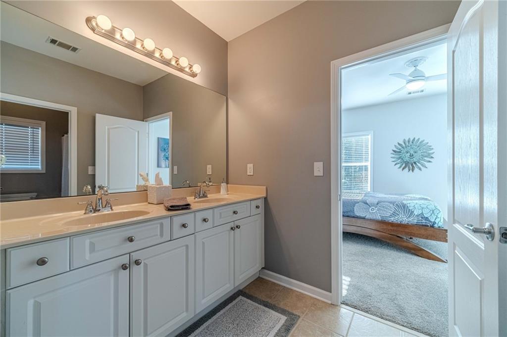 1245 White Columns Drive Monroe, GA 30656 - Photo 21 of 52 a en suite bathroom with double sink and a mirror