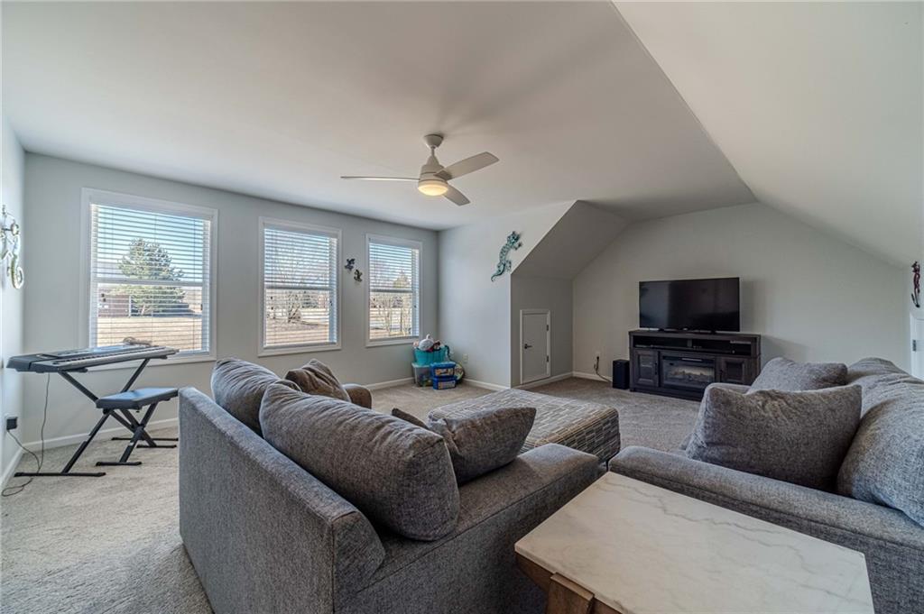 1245 White Columns Drive Monroe, GA 30656 - Photo 34 of 52 a living room with furniture and a flat screen tv