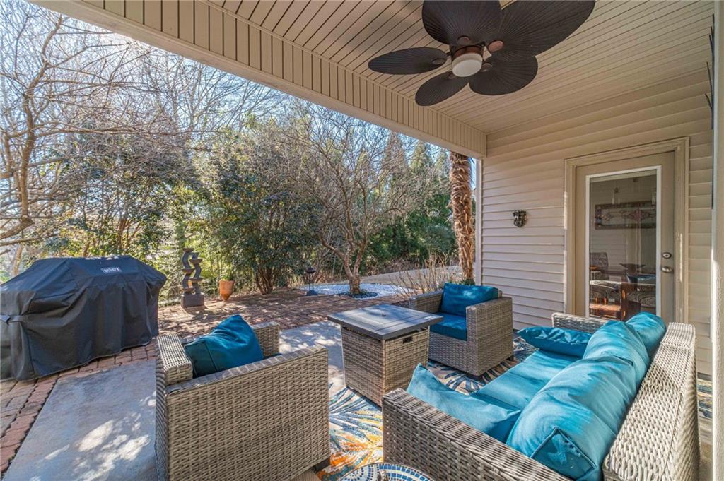 1245 White Columns Drive Monroe, GA 30656 - Photo 43 of 52 a view of a patio with couches chairs and a fire pit