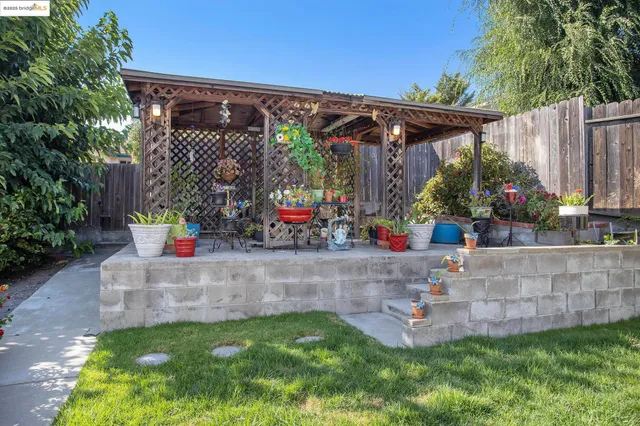 a view of patio with chairs and tables