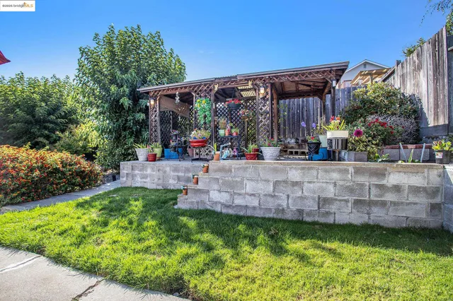 an aerial view of houses with yard
