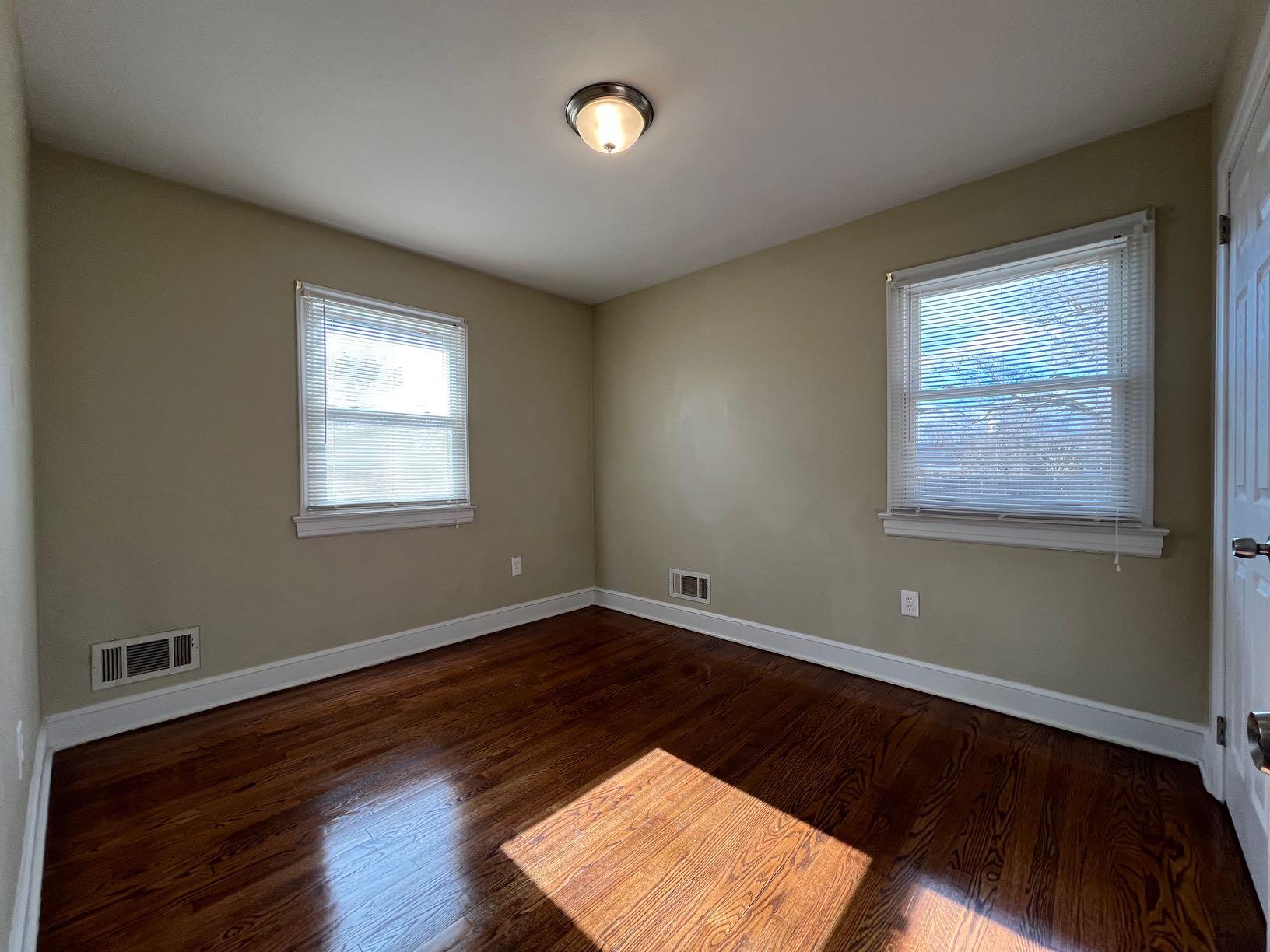 1939 Barrington Drive Northwest Roanoke, VA 24017 - Photo 12 of 14 a view of an empty room with wooden floor and a window