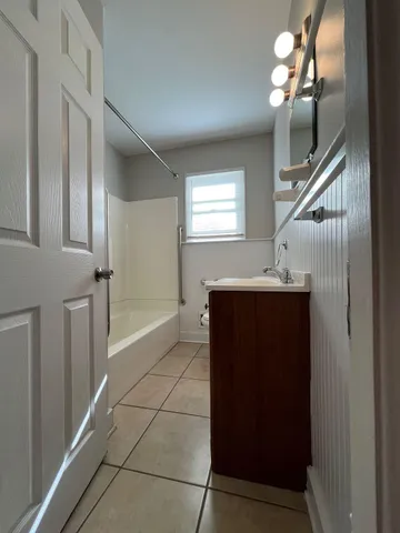 a view of entryway and hall with a front door