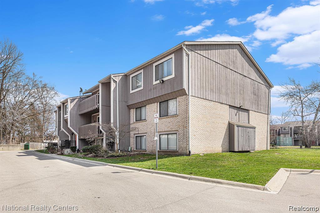 29870 West 12 Mile Road, Unit 703 Farmington, MI 48334 - Photo 39 of 40 Multi-story building featuring paneled siding and brick veneer