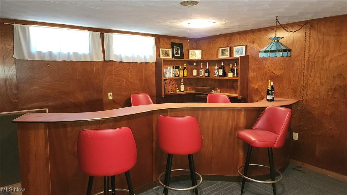 8355 Dalepoint Road Independence, OH 44131 - Photo 22 of 27 Bar featuring wooden walls and bar
