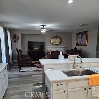 a living room with furniture and chandelier