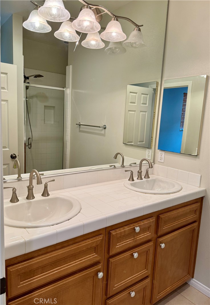 238 Coral Rose Irvine, CA 92603 - Photo 15 of 19 a bathroom with a sink and a mirror