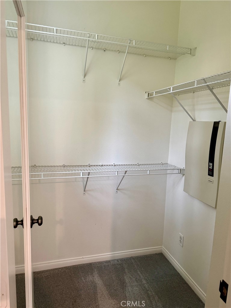 238 Coral Rose Irvine, CA 92603 - Photo 16 of 19 a view of a room with racks on the wall