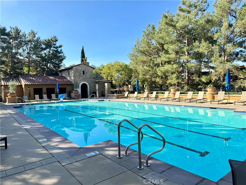 238 Coral Rose Irvine, CA 92603 - Photo 18 of 19 a view of a white house with a big yard and sitting area