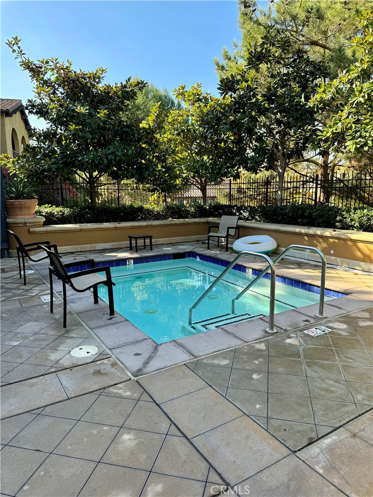 238 Coral Rose Irvine, CA 92603 - Photo 19 of 19 a bench sitting in the middle of a park with large trees