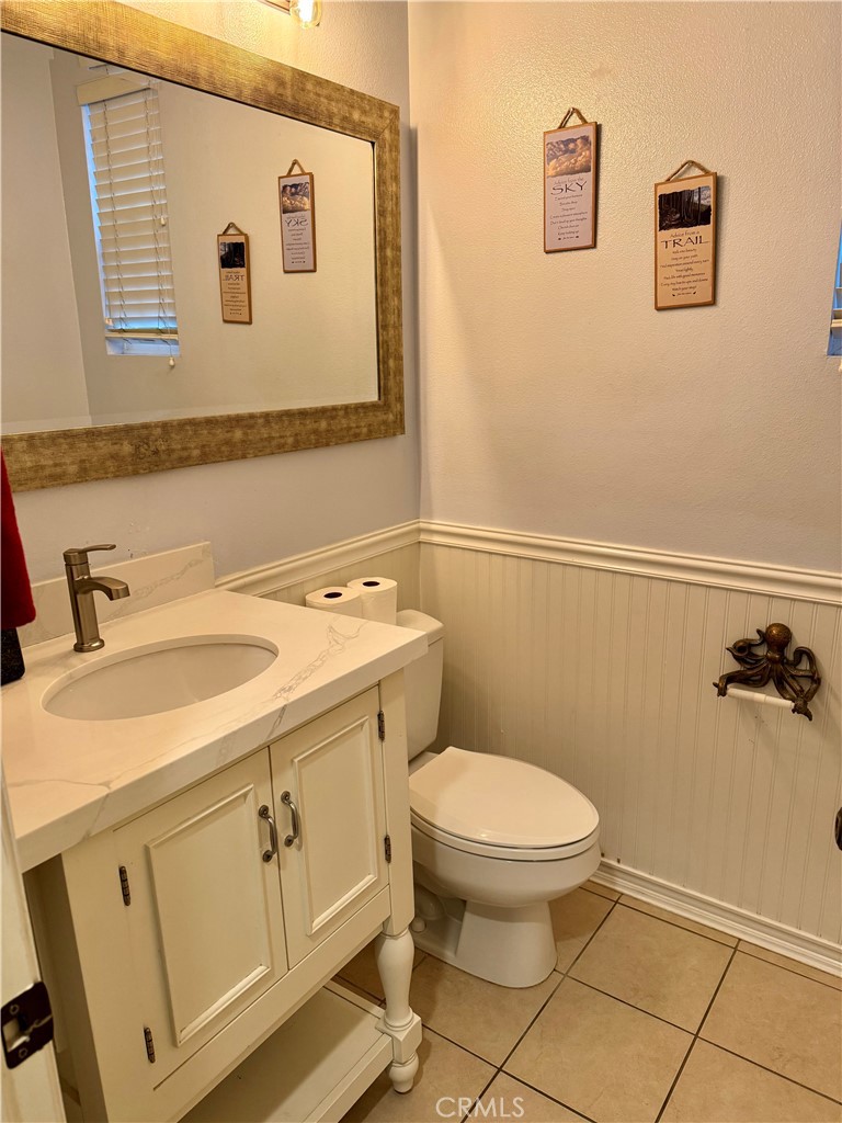 238 Coral Rose Irvine, CA 92603 - Photo 8 of 19 a bathroom with a sink a toilet and a mirror