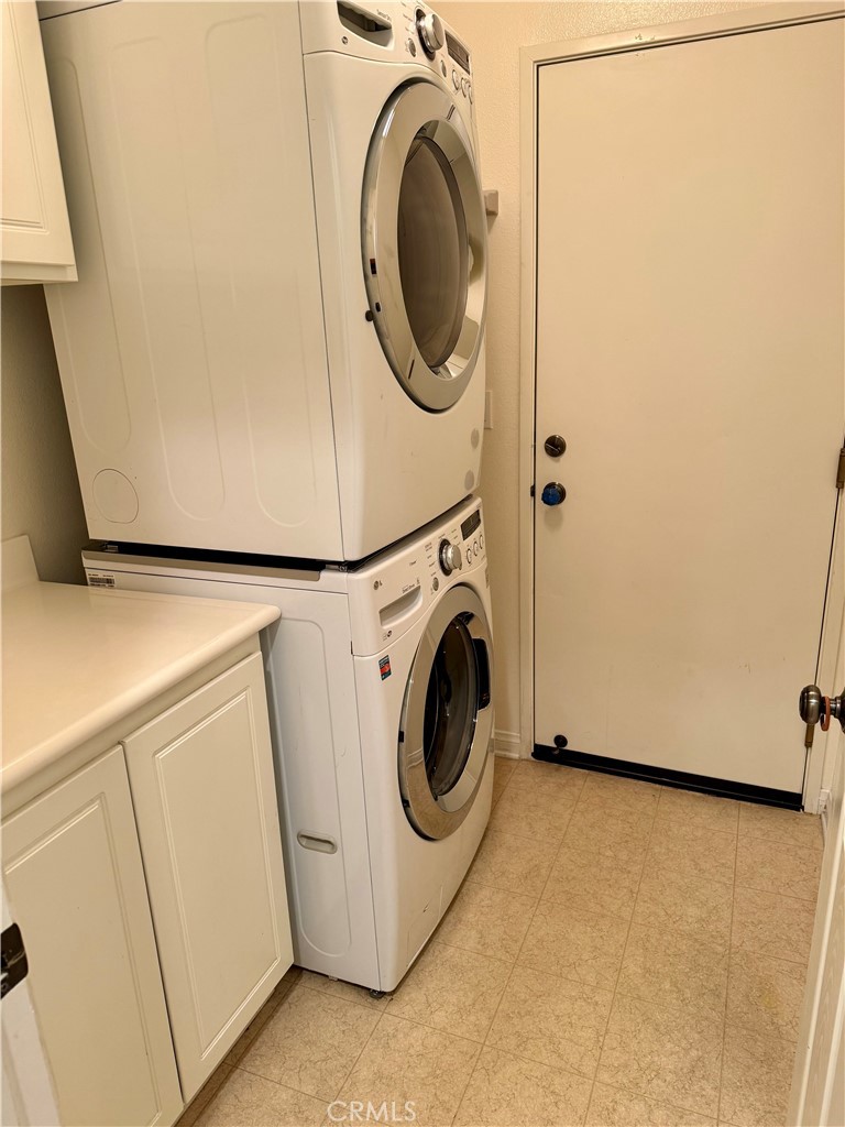 238 Coral Rose Irvine, CA 92603 - Photo 9 of 19 a utility room with dryer and washer