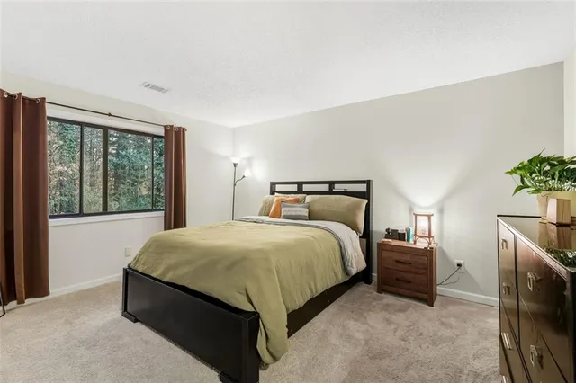 a bedroom with a bed and a fireplace