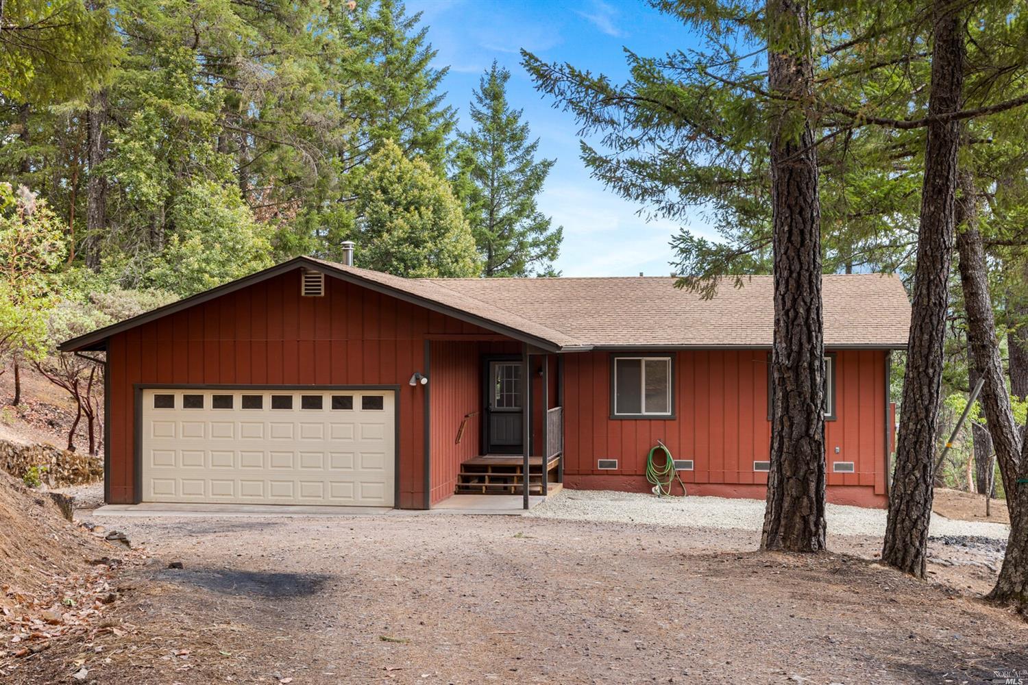5151 Ridgewood Road Willits, CA 95490 - Photo 1 of 1 a house with trees in the background