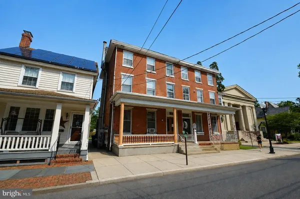 a front view of a house with a porch