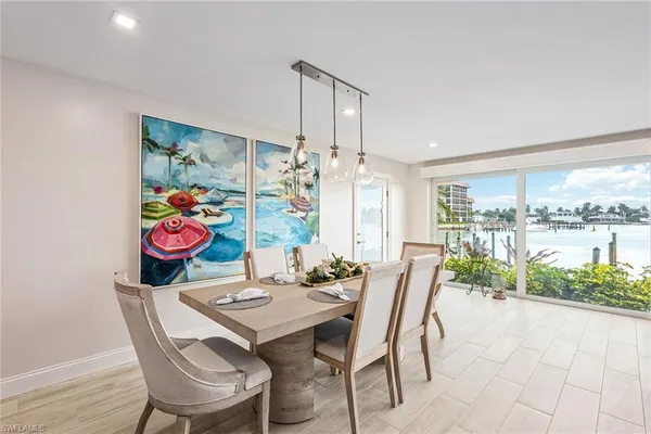 a view of a dining room with furniture toys and wooden floor