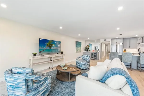 a living room with fireplace furniture and a flat screen tv