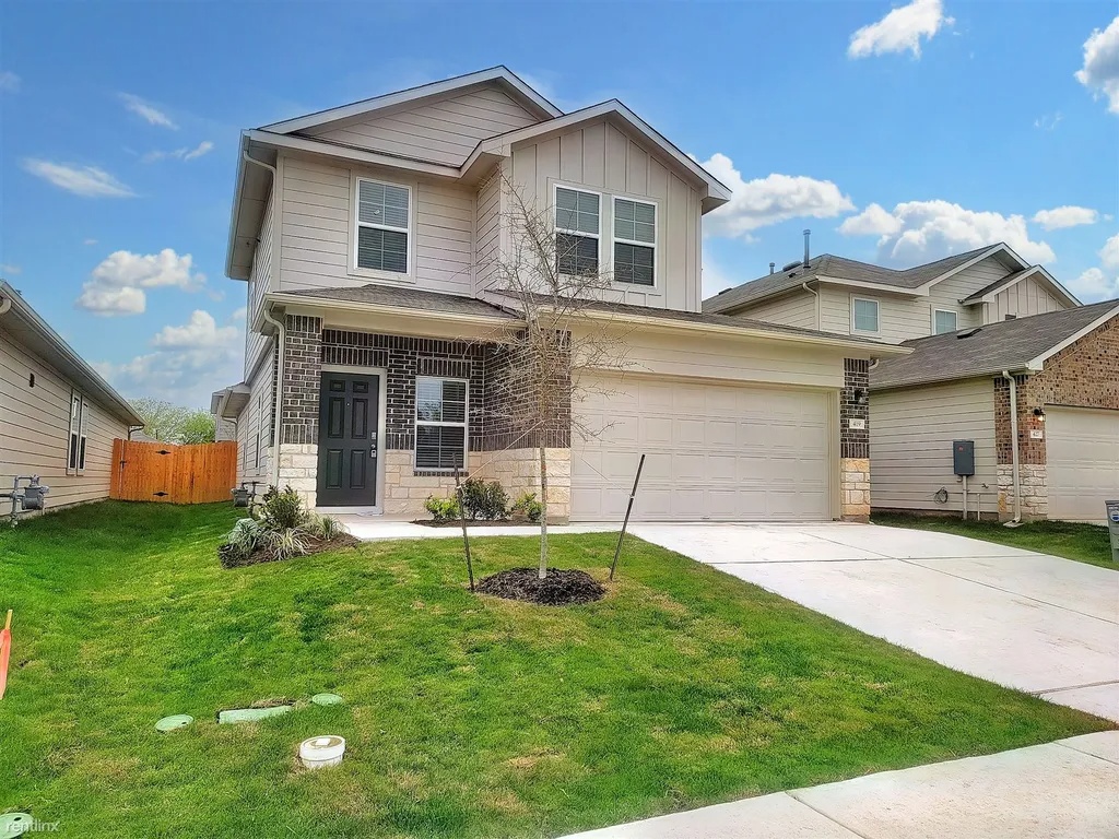 A well-maintained facade with a two-car garage awaits in this inviting residence.