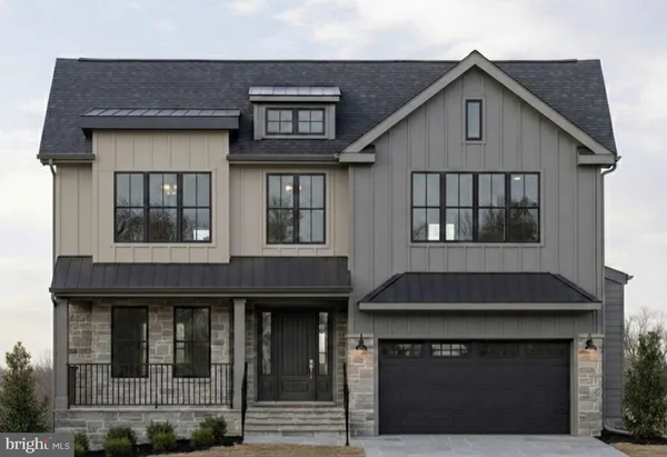 a front view of a house with glass windows