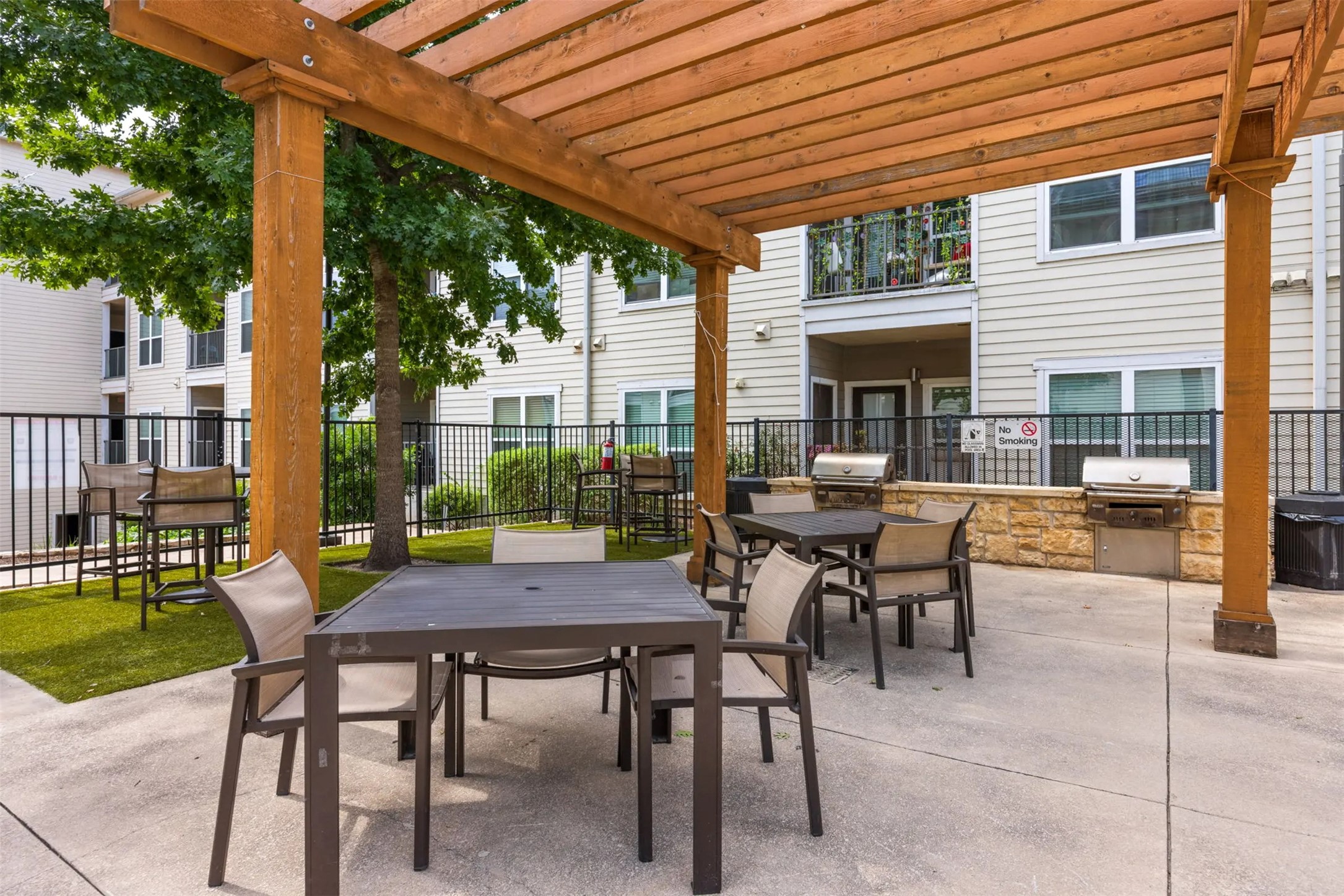 6725 Circle S Road, Unit A2102 Austin, TX 78745 - Photo 19 of 23 a view of a patio with a table and chairs