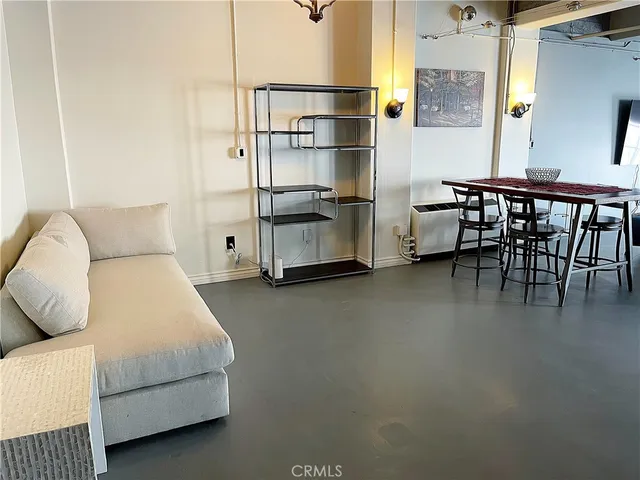 a bedroom with furniture and a bed