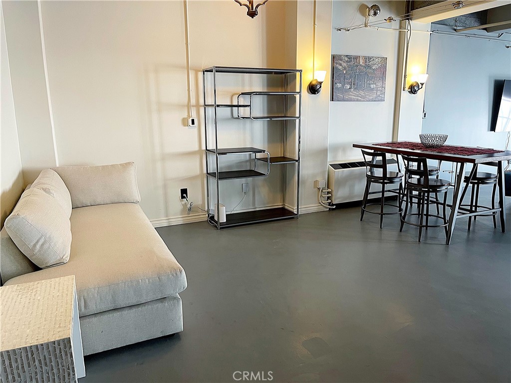 312 West 5th Street, Unit 1003 Los Angeles, CA 90013 - Photo 11 of 20 a bedroom with furniture and a bed