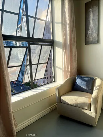 a living room with a couch and a window